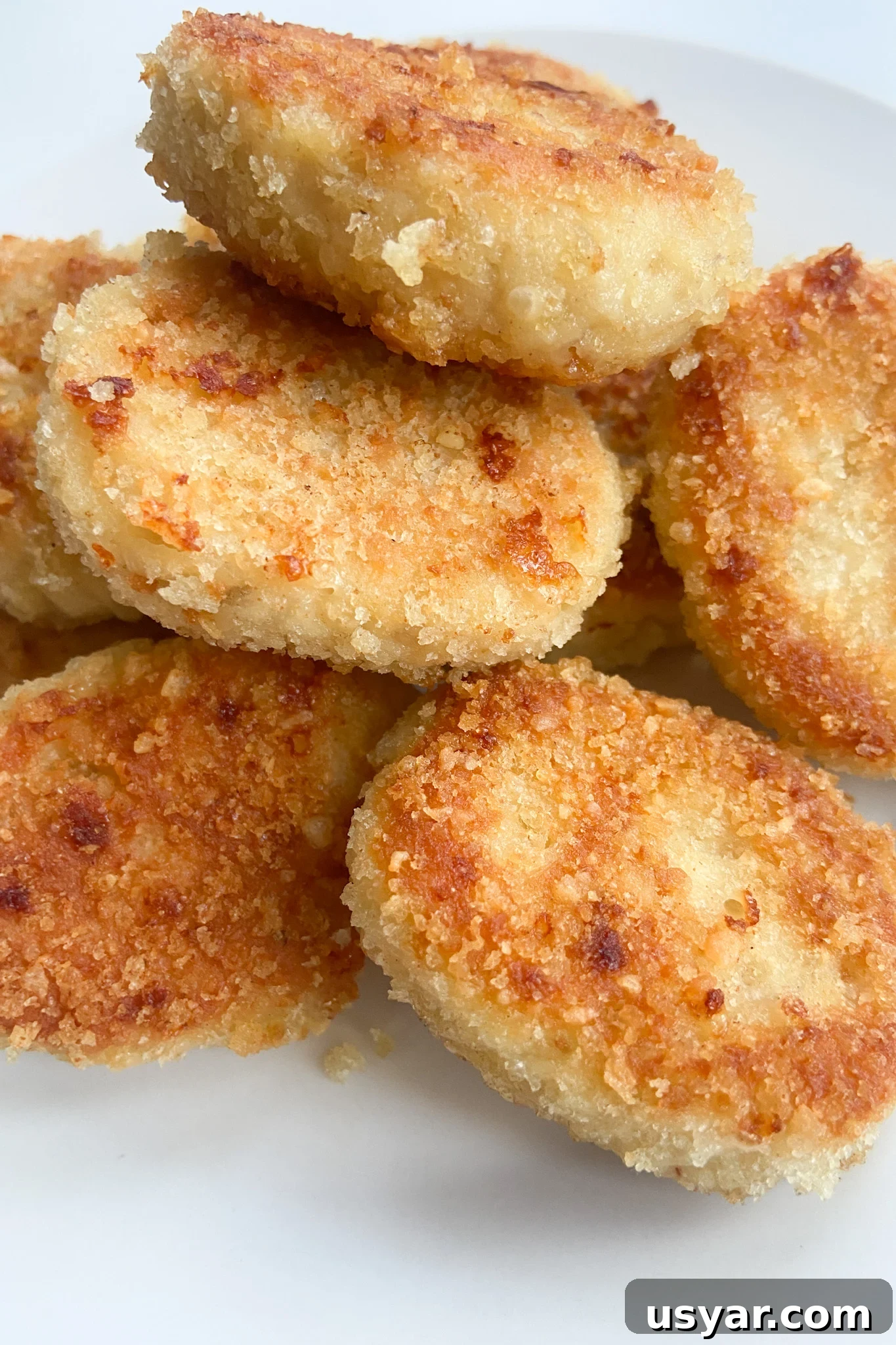 Turn Leftover Turkey into Crispy Nuggets 5 Leftover turkey nuggets served on a white plate