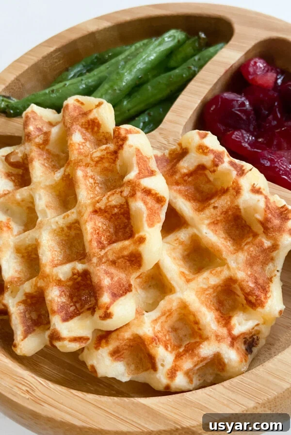 Mashed potato waffles served with green beans and mashed potatoes.