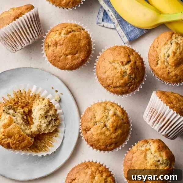 No-Bake Peanut Butter Oat Energy Balls Recipe 7 An assortment of baked Banana Muffins on a white surface and plate, ready to eat.