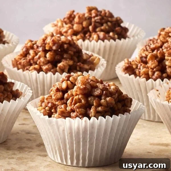 No-Bake Peanut Butter Oat Energy Balls Recipe 8 Rows of rice crispy cakes in cupcake cases, ready to eat.