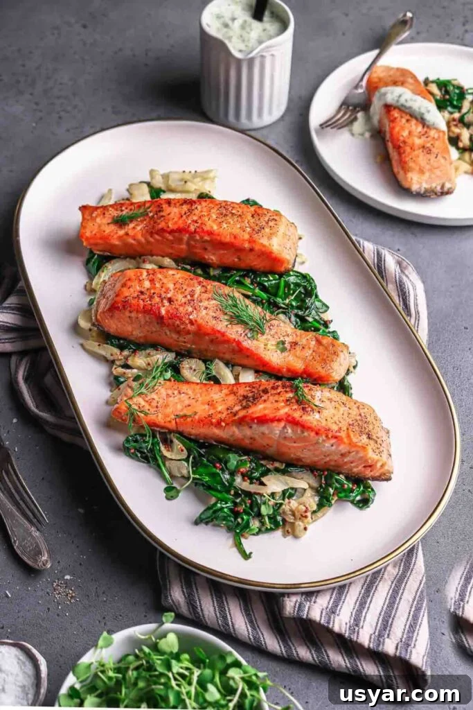 Crispy Pan-Seared Salmon with Spinach and Fennel Recipe 2 Seared Salmon with spinach and fennel on a plate
