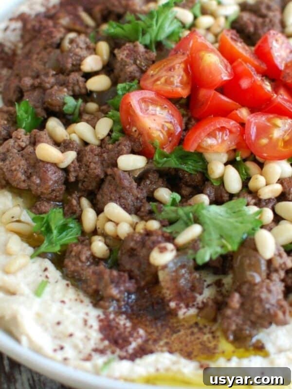 Korean Beef Bulgogi with Zucchini Noodles 13 Hummus with Spiced Beef and Toasted Pine Nuts on white plate