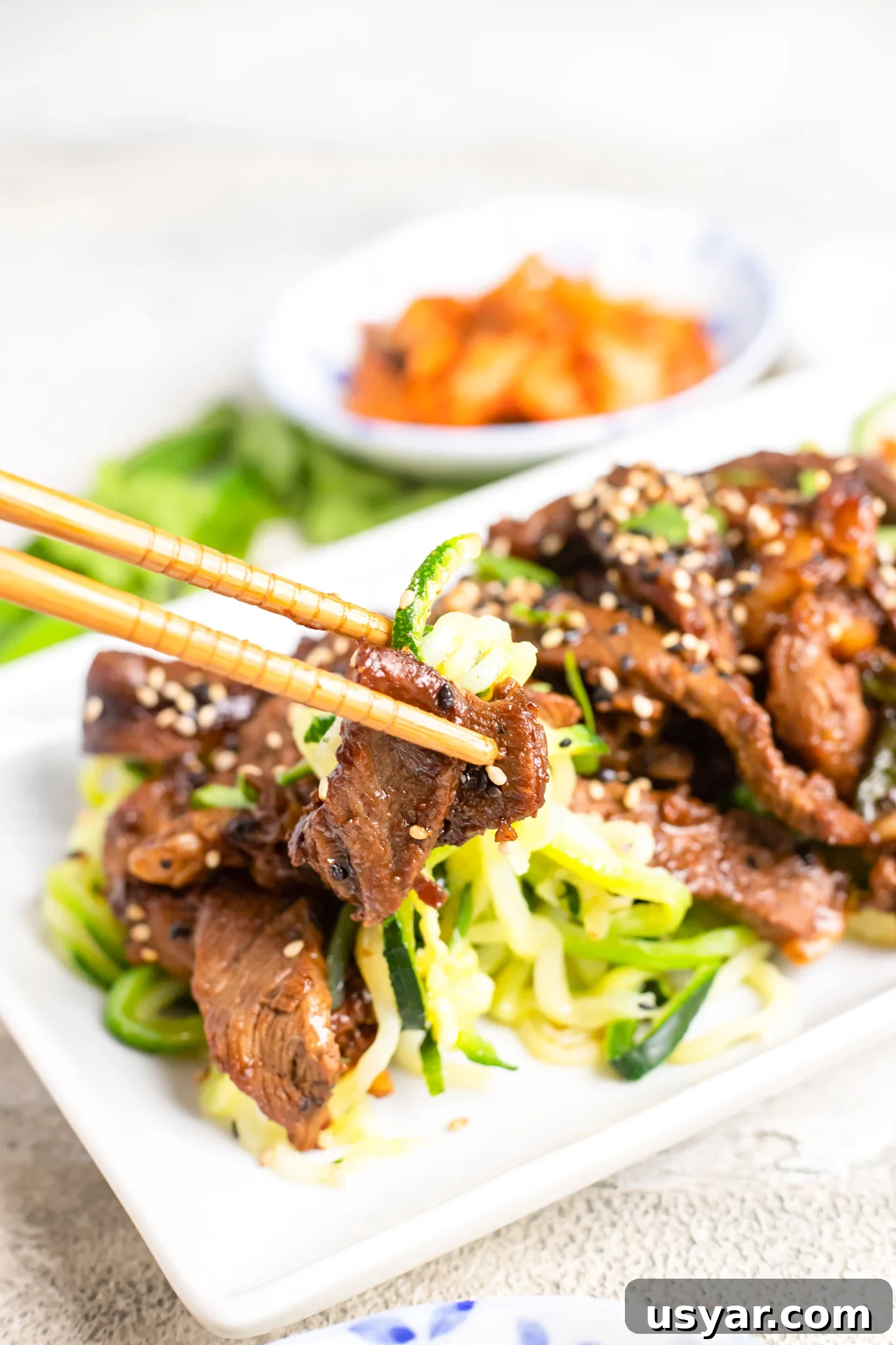 Korean Beef Bulgogi with Zucchini Noodles 9 Beef Bulgogi with Zucchini Noodles with chopsticks.