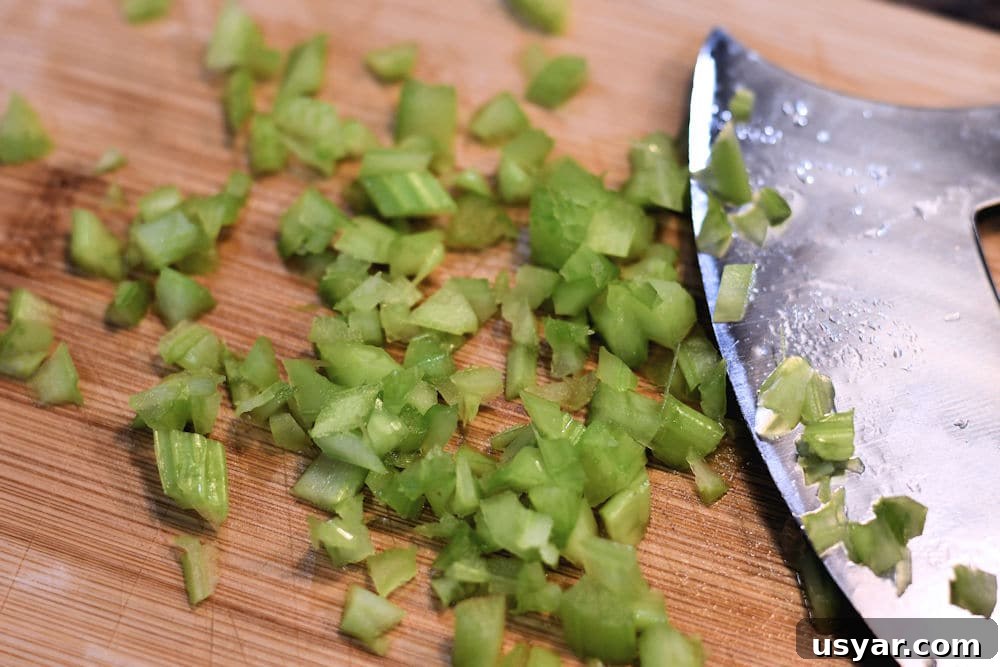 Crab Stuffed Mushrooms for Air Fryer or Oven 5 Finely chopped celery with ulu on cutting board