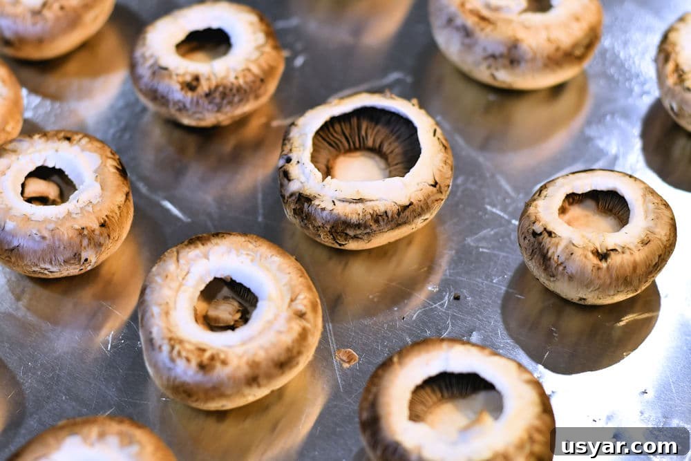 Crab Stuffed Mushrooms for Air Fryer or Oven 6 empty mushroom caps on baking sheet
