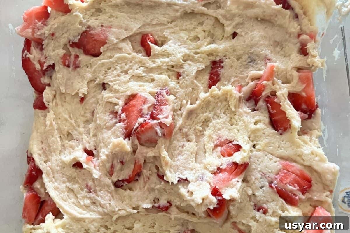 Moist Strawberry Yogurt Cake Recipe with Fresh Berries 7 Strawberry yogurt cake batter poured into cake pan.