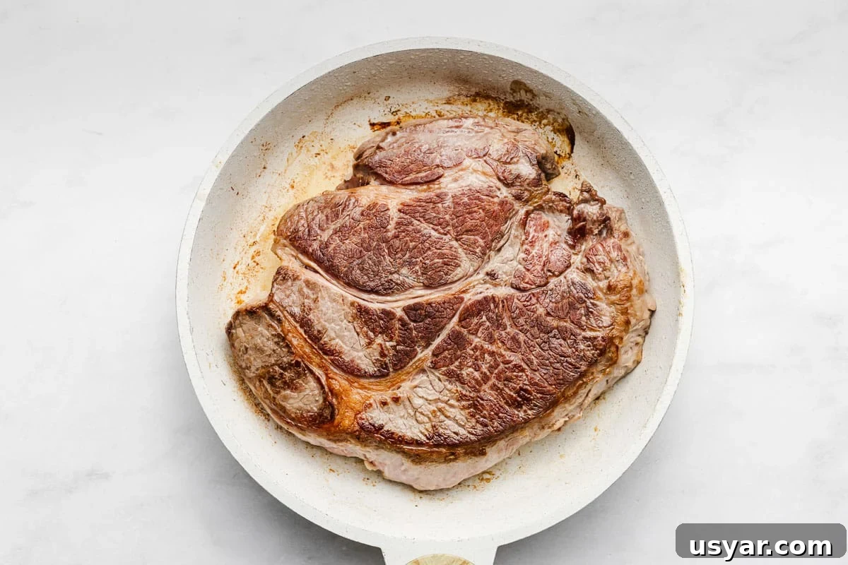 Garlic Herb Slow Cooker Pot Roast Recipe 3 Pot roast with carrots and onions in slow cooker