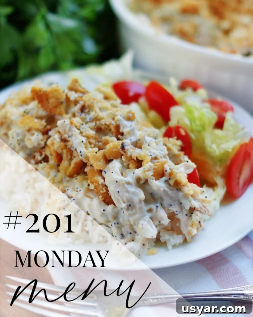 A serving of poppyseed chicken on a white plate with a salad and Monday Menu title overlay