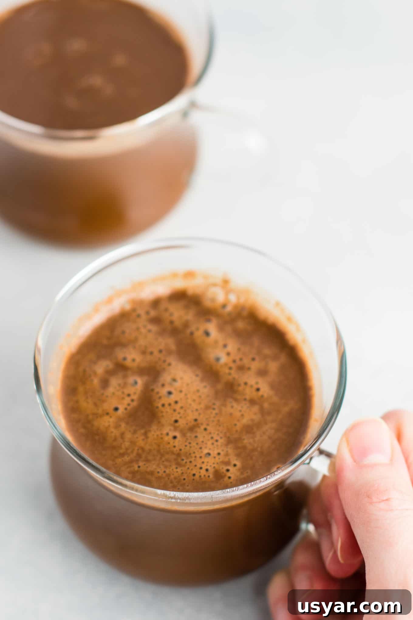 Decadent Vegan Hot Chocolate Recipe 3 Easy 4 Ingredient vegan hot chocolate recipe made with almond milk. Dairy free, gluten free, and vegan. The perfect cozy winter drink! #vegan #hotchocolate #drinks #christmas #dairyfree