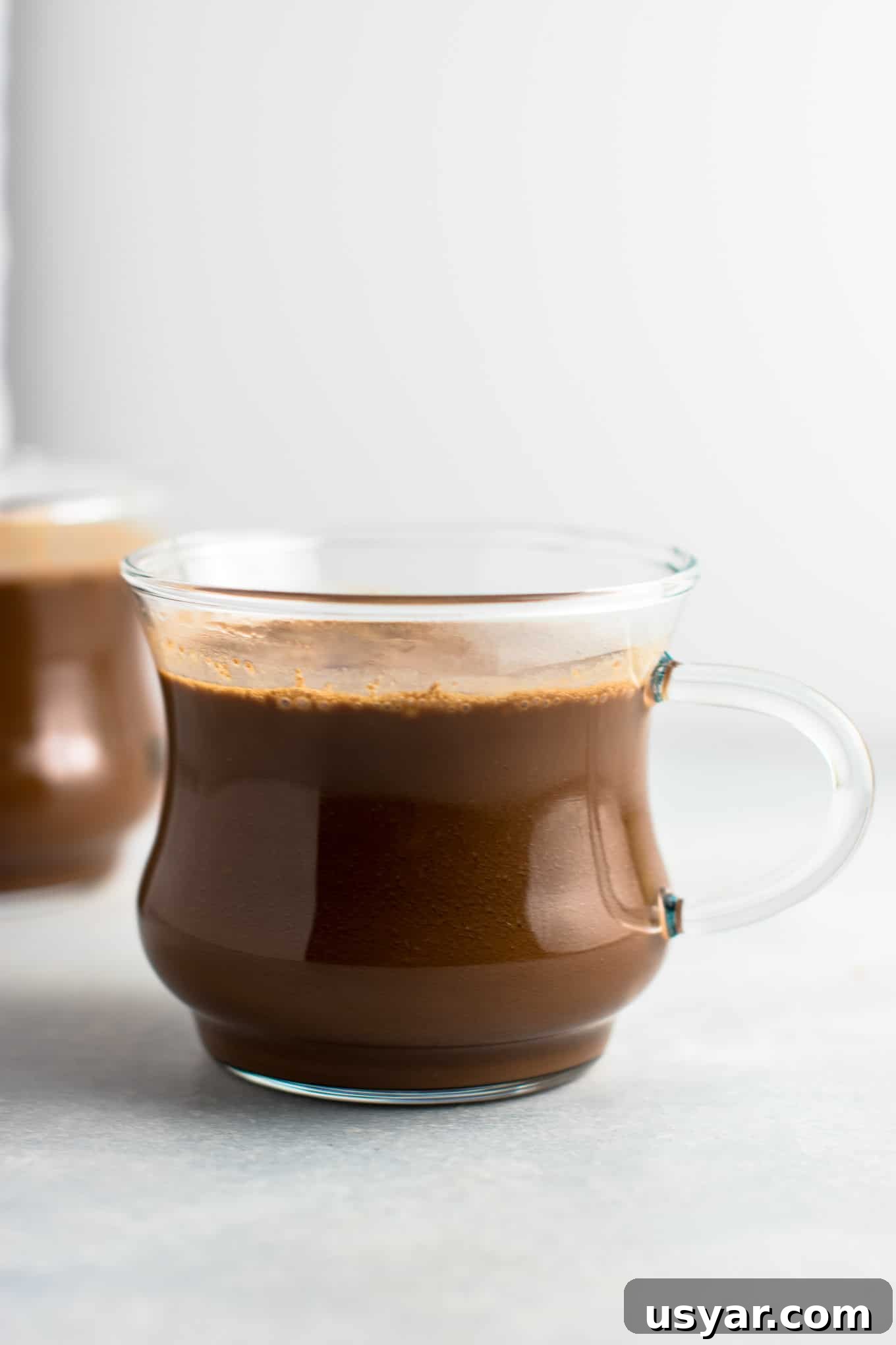 Decadent Vegan Hot Chocolate Recipe 4 Easy 4 Ingredient vegan hot chocolate recipe made with almond milk. Dairy free, gluten free, and vegan. The perfect cozy winter drink! #vegan #hotchocolate #drinks #christmas #dairyfree