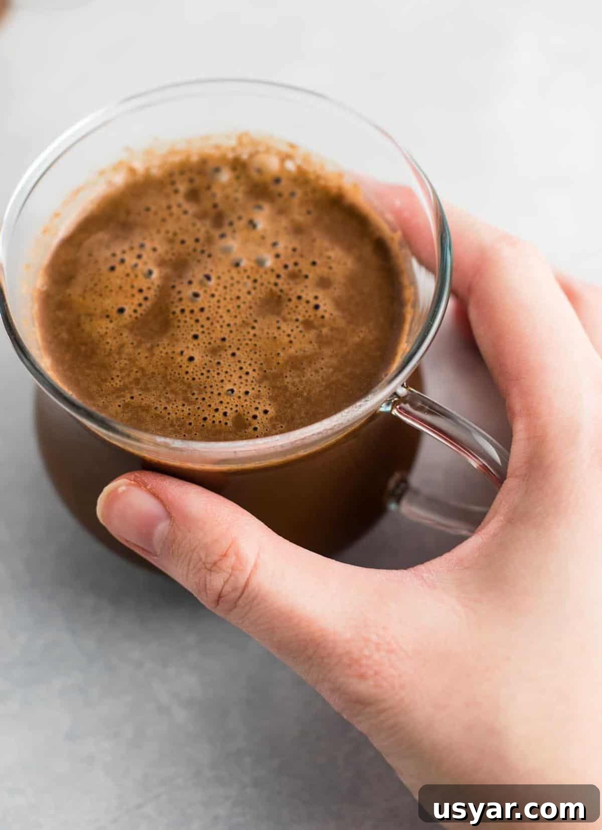 Decadent Vegan Hot Chocolate Recipe 5 Easy 4 Ingredient vegan hot chocolate recipe made with almond milk. Dairy free, gluten free, and vegan. The perfect cozy winter drink! #vegan #hotchocolate #drinks #christmas #dairyfree