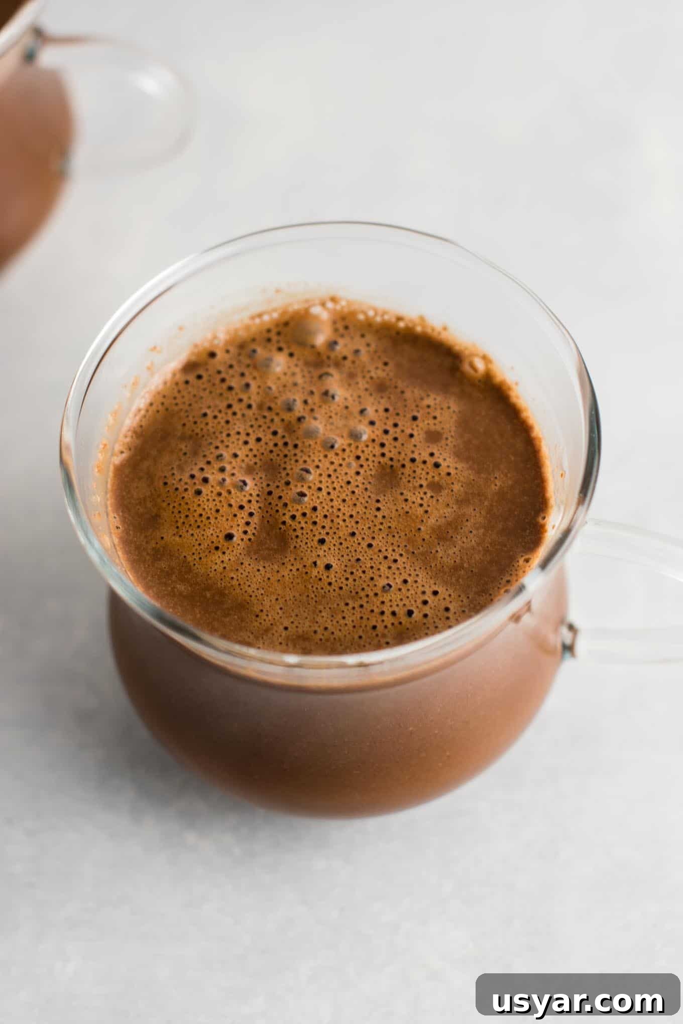 Decadent Vegan Hot Chocolate Recipe 6 Easy 4 Ingredient vegan hot chocolate recipe made with almond milk. Dairy free, gluten free, and vegan. The perfect cozy winter drink! #vegan #hotchocolate #drinks #christmas #dairyfree