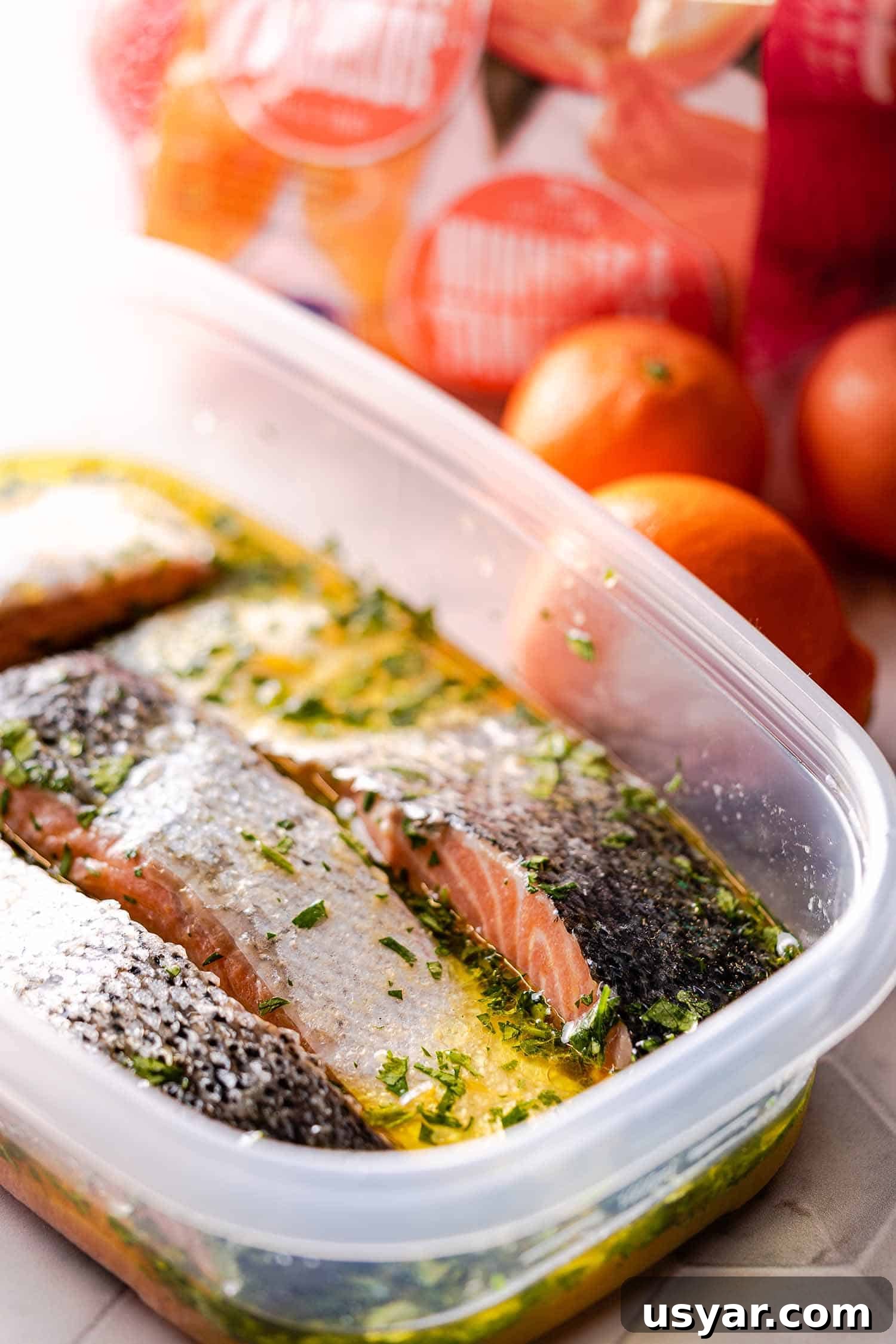 Citrus Herb Salmon with Orange and Red Onion Salsa 7 salmon marinating in plastic container