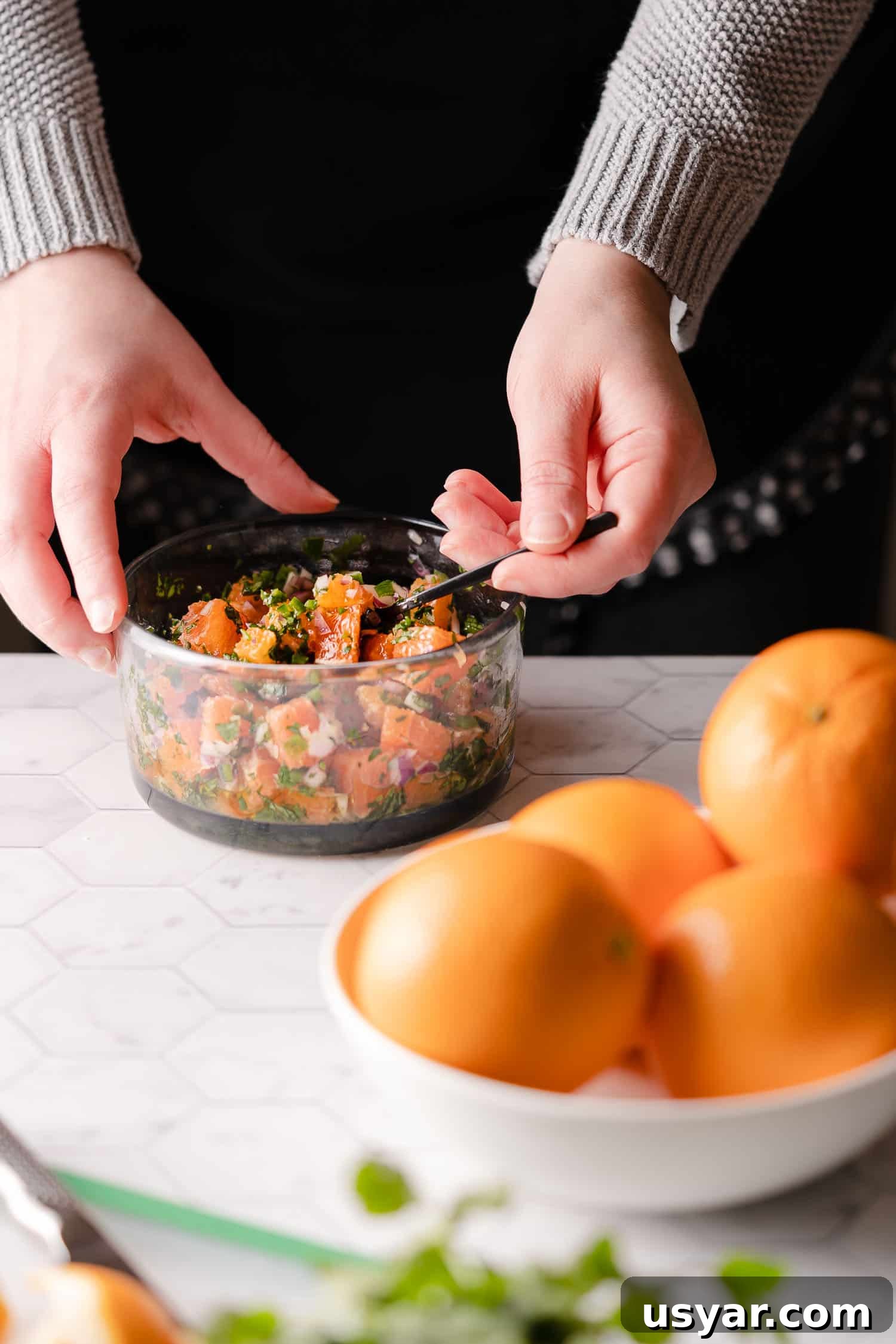 Citrus Herb Salmon with Orange and Red Onion Salsa 8 Mixing orange red onion salsa in clear bowl