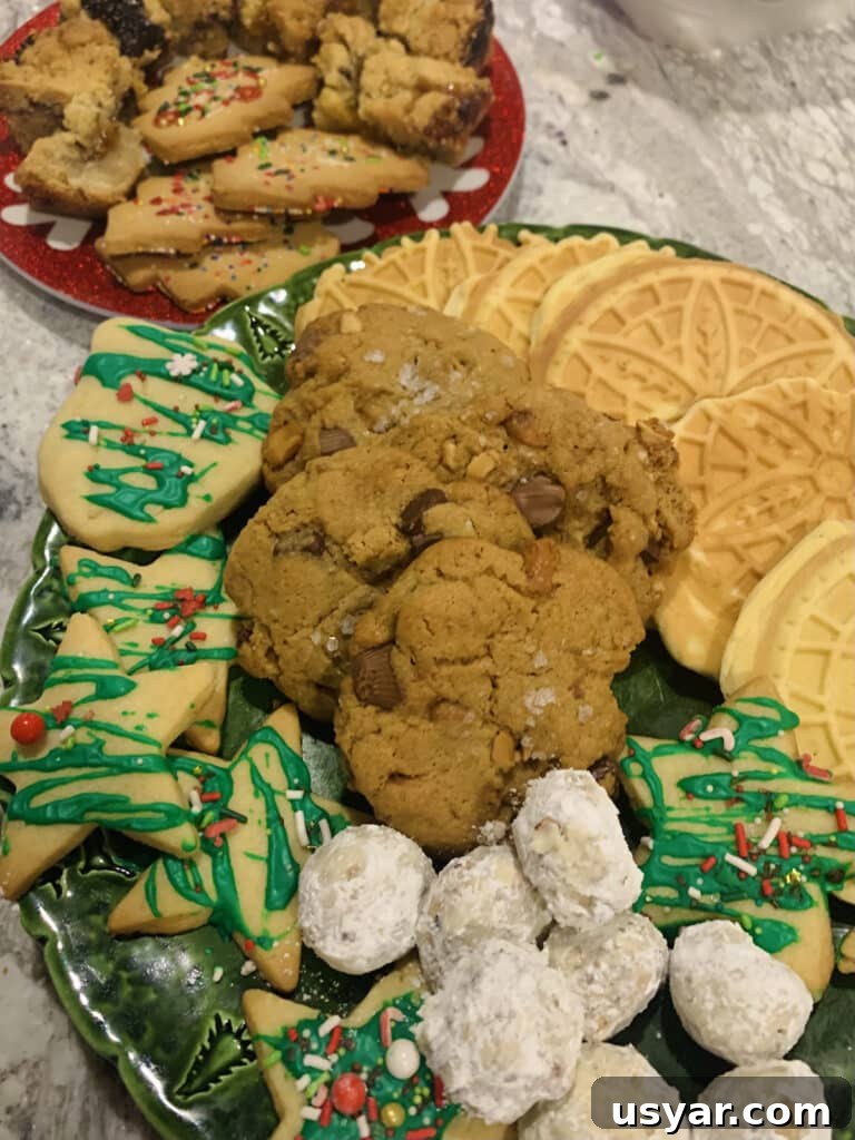Sea Salt Peanut Butter Cup Chocolate Chip Cookies with Nuts 3 Assorted Christmas cookie platter, containing Buttery Pecan Snowball Cookies, Anise Pizzelles and Peanut Butter Cup Chocolate Chip Cookies.
