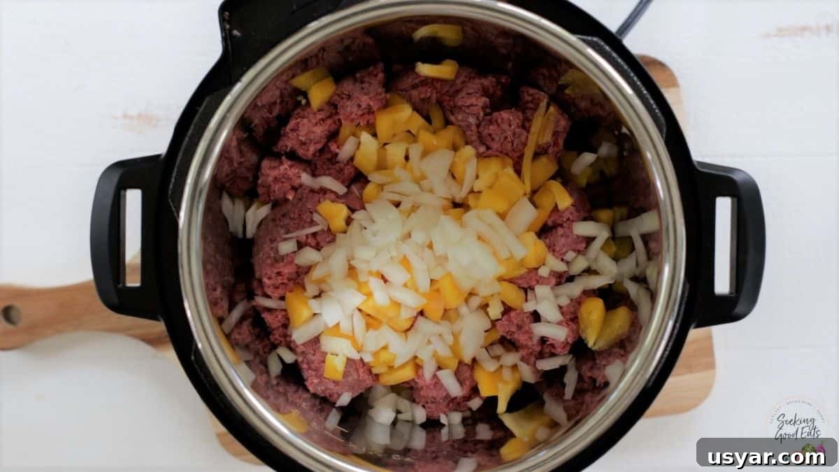 Beef Taco Soup with Ground Beef and Beans 3 Sauteing the ground beef and vegetables in an instant pot.