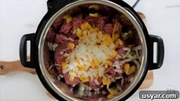 Beef Taco Soup with Ground Beef and Beans 7 Sauteing the ground beef and vegetables in an instant pot.