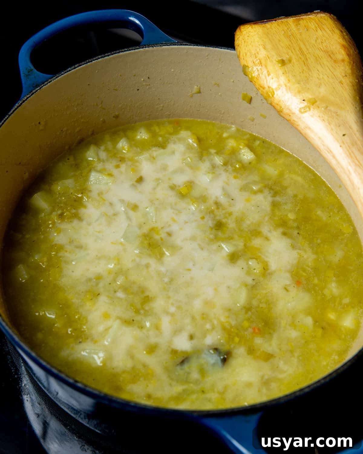 Creamy Vegan Leek and Potato Soup Vichyssoise 13 Photo of cooked leek and potato soup with oat milk added into the pan (before stirring through).