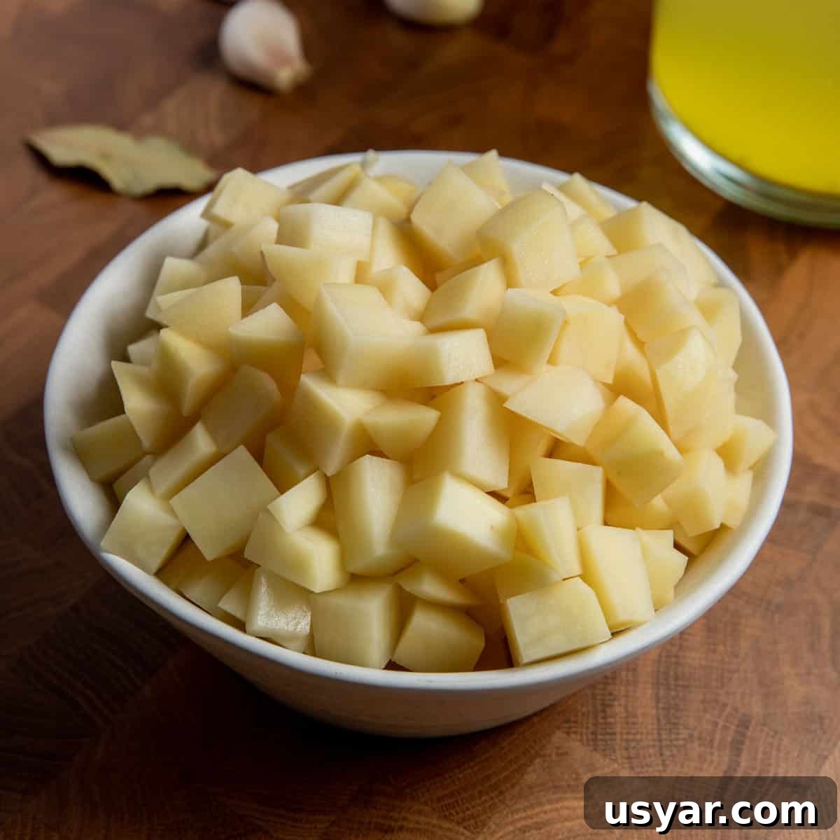 Creamy Vegan Leek and Potato Soup Vichyssoise 9 Photo of a bowl of potatoes cut into small cubes.