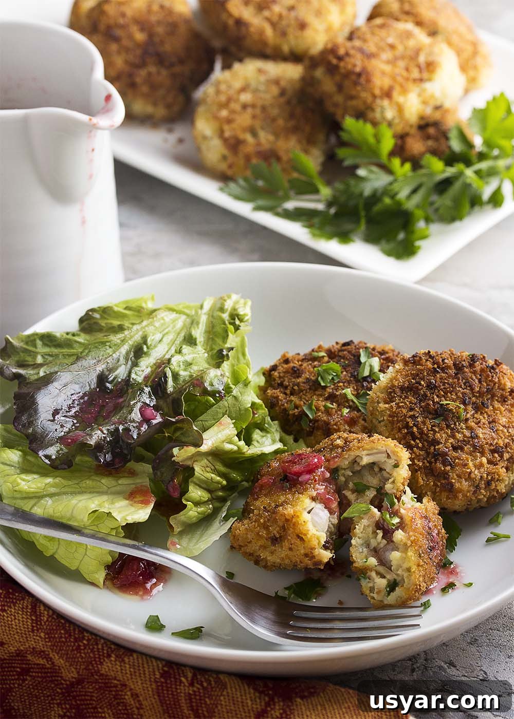 Crispy Leftover Turkey and Stuffing Croquettes Recipe 4 Turkey stuffing croquettes with a cranberry vinaigrette are a great way to transform your Thanksgiving and holiday leftovers into a new meal! | justalittlebitofbacon.com