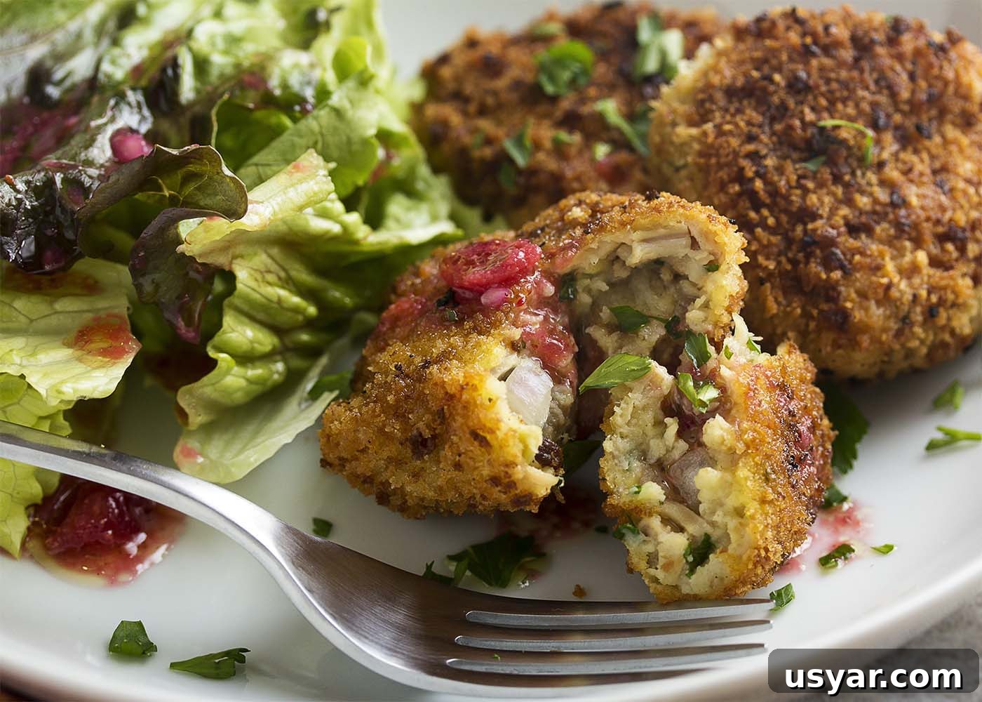 Crispy Leftover Turkey and Stuffing Croquettes Recipe 5 Turkey stuffing croquettes with a cranberry vinaigrette are a great way to transform your Thanksgiving and holiday leftovers into a new meal! | justalittlebitofbacon.com
