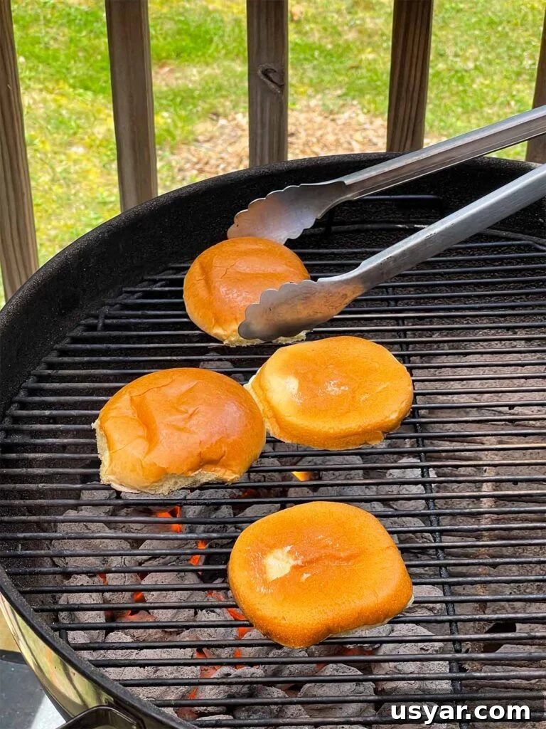 Carolina-Style Grilled Chicken Burger Recipe 19 Buns being toasted on the grill.