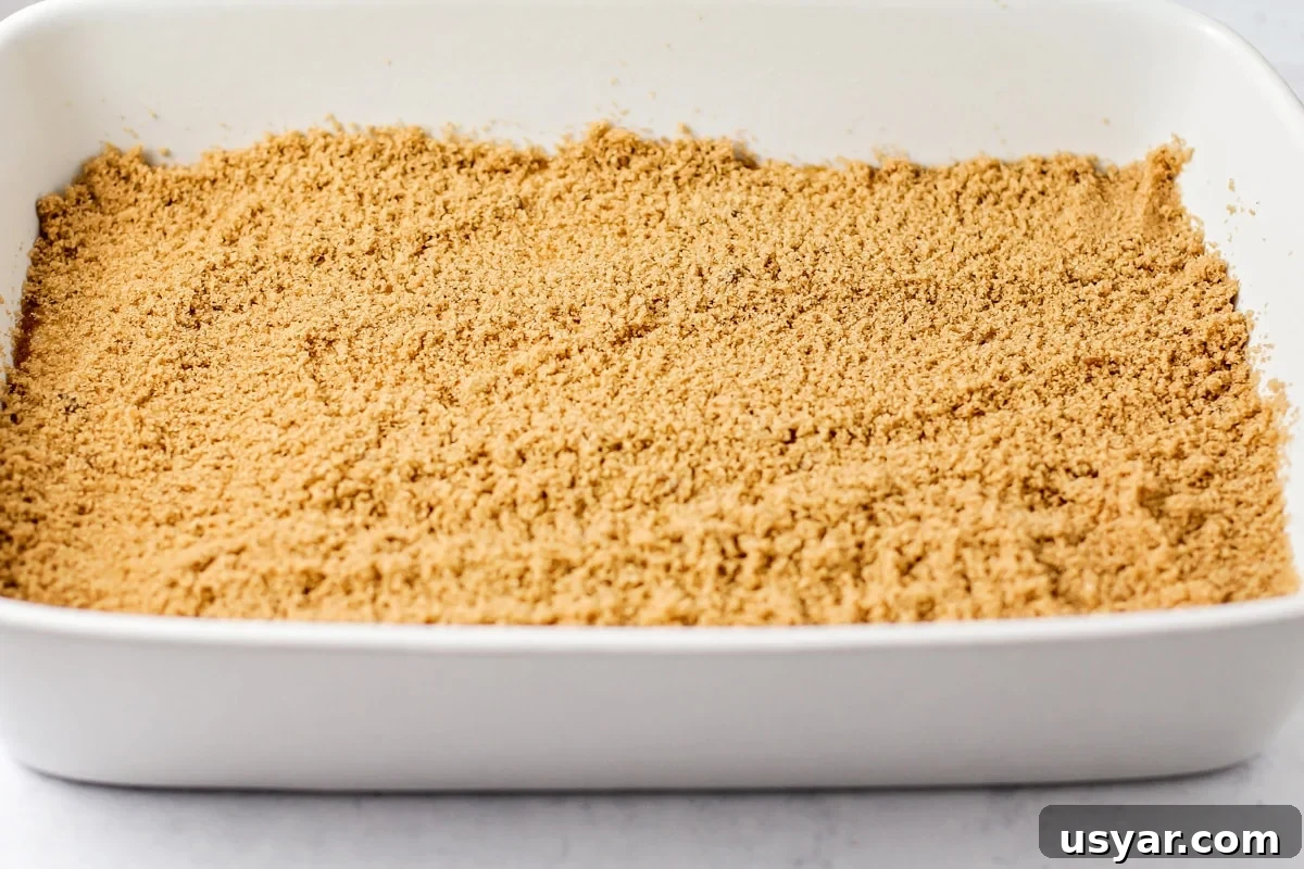 Classic Cinnamon Coffee Cake with Crumb Topping 5 Brown sugar crumble on top of coffee cake batter layer.