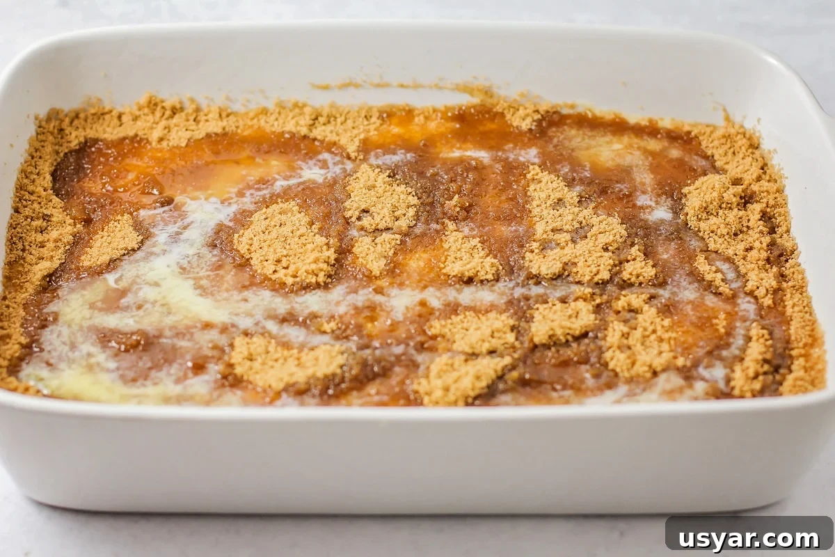 Classic Cinnamon Coffee Cake with Crumb Topping 6 Melted butter drizzled over cake batter.