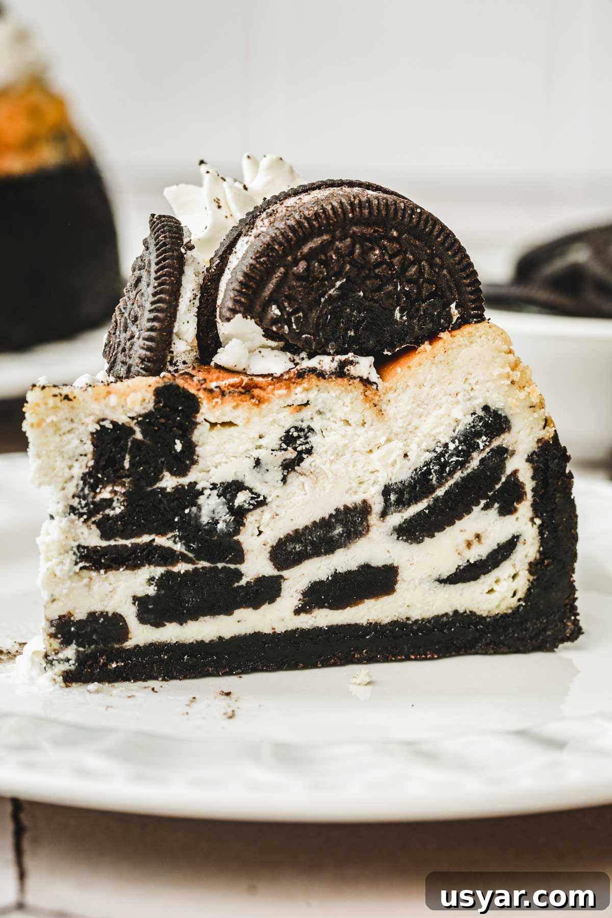 slice of oreo cheesecake served on a plate