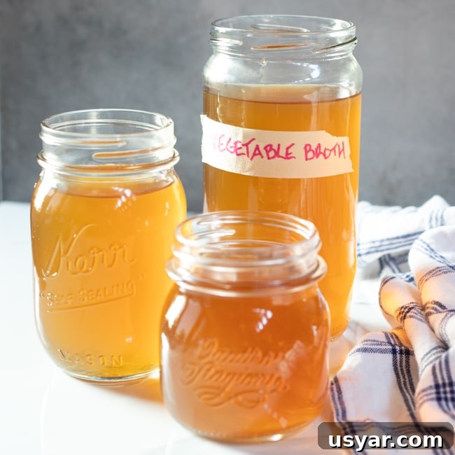 Vegetable broth on three jars, one of which is labeled vegetable broth.