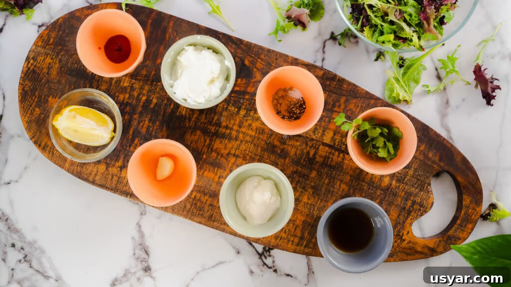 Ingredients for curry yogurt salad dressing displayed on a surface