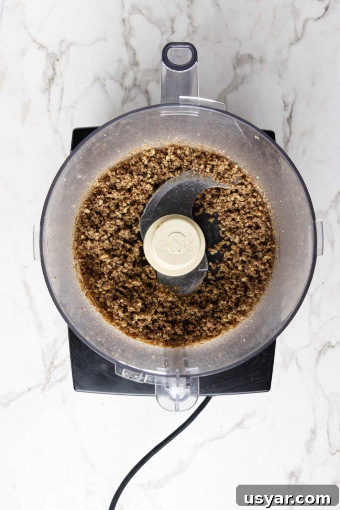 Mexican Snowball Cookies Recipe (Polvorones) 4 Blending pecans in a food processor.