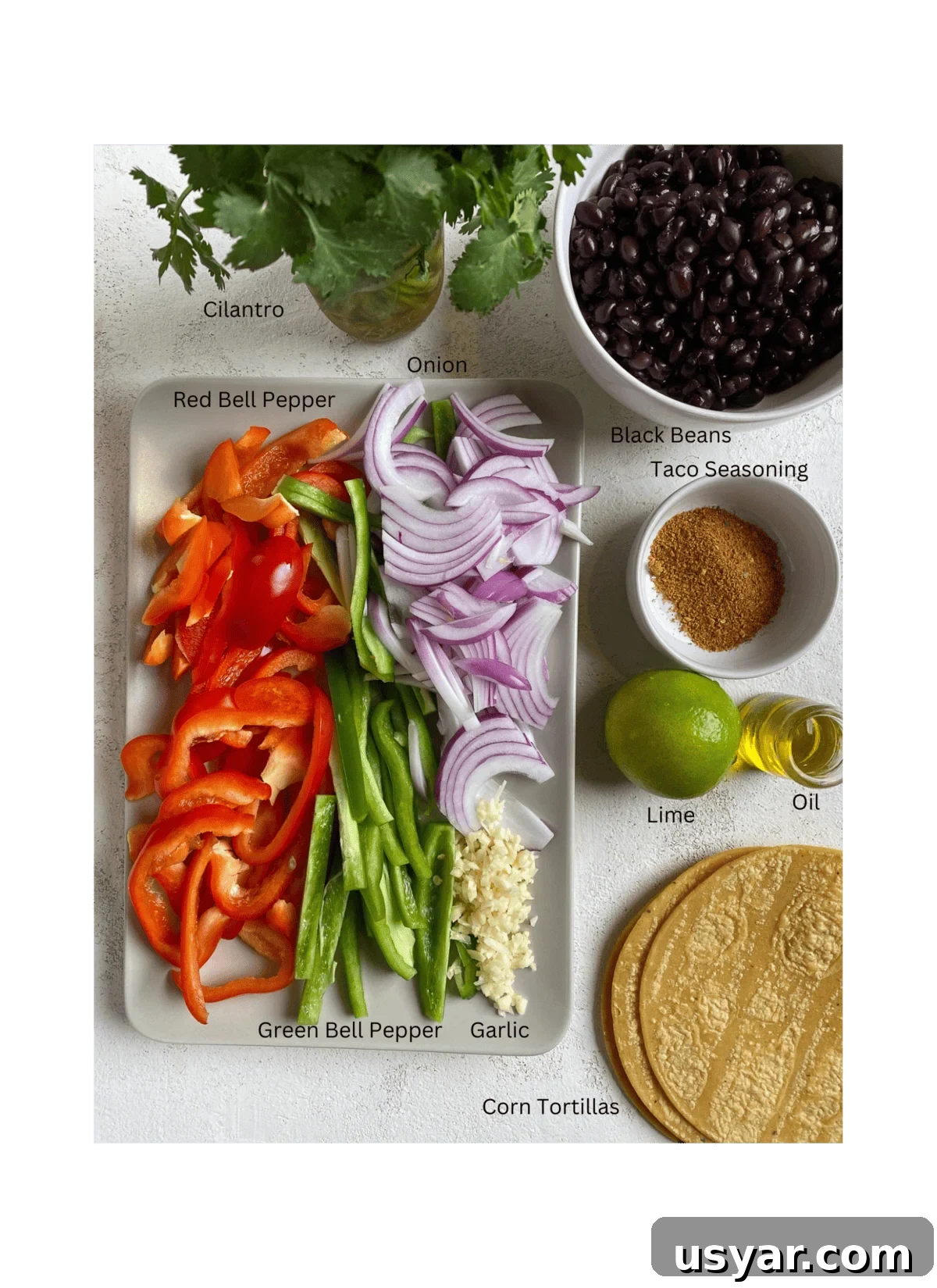 ingredients for Vegan Fajita Tacos against a white surface