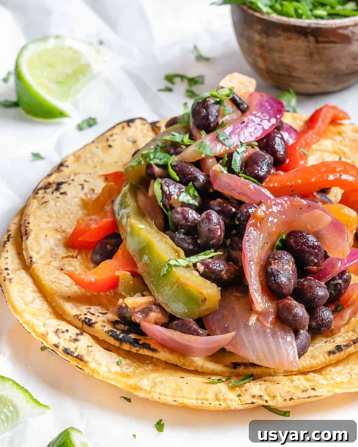 completed Vegan Fajita Tacos against a white surface