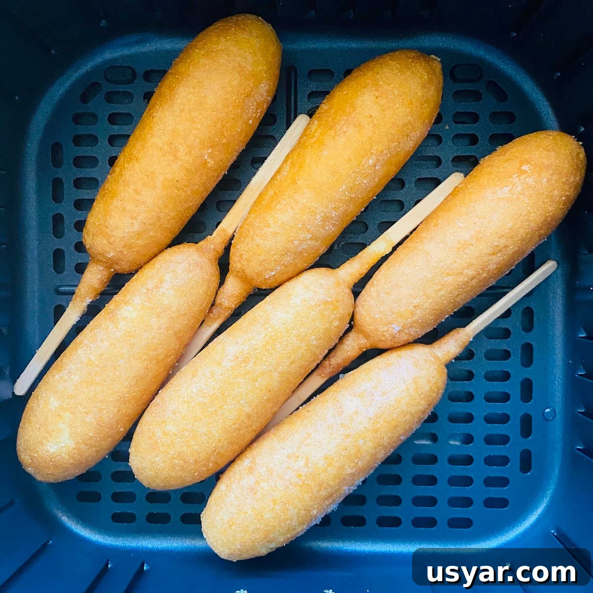 Crispy Air Fryer Corn Dogs Recipe 4 frozen corn dogs in air fryer basket