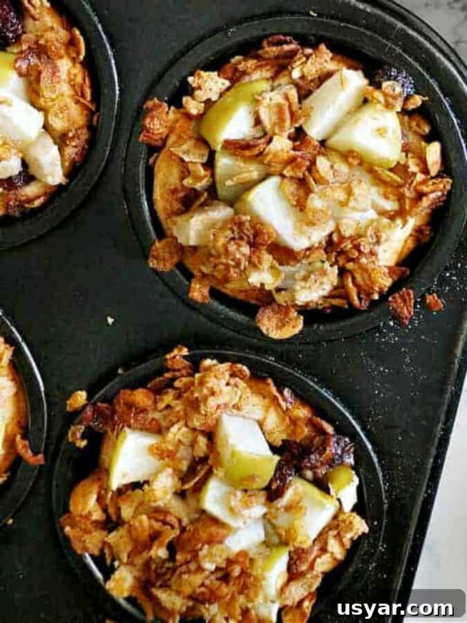 cinnamon roll apple pies in muffin tin. 