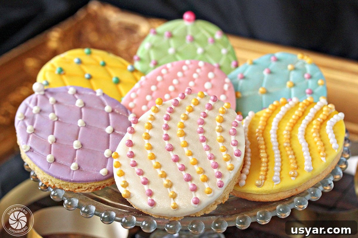 Decorated Easter Egg Sugar Cookies with fondant and sugar pearls Easter egg sugar cookies on a gold tray with colorful sugar pearls