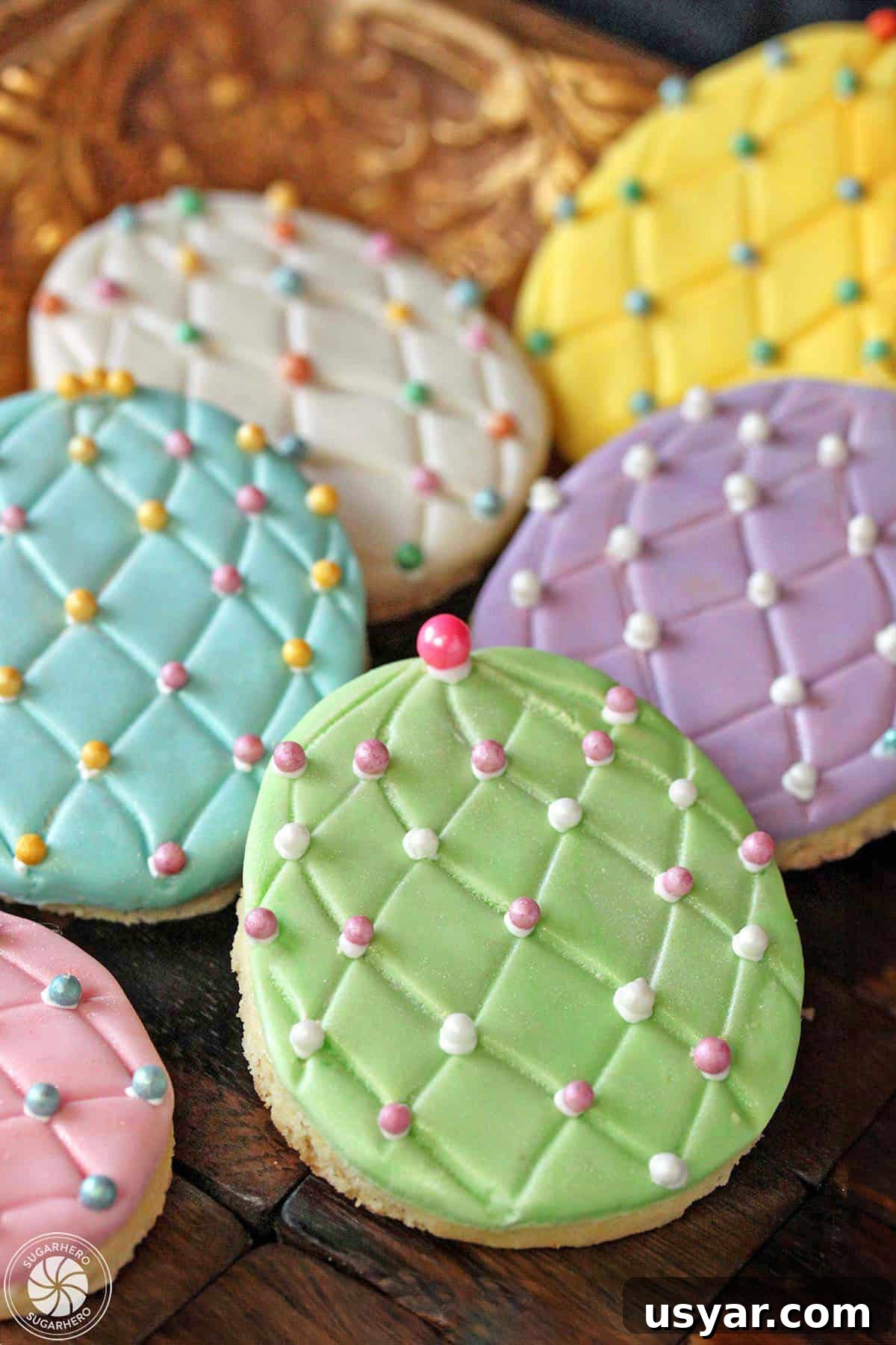 Three decorated Easter Egg Sugar Cookies on a gold tray Three Easter egg sugar cookies on a gold tray