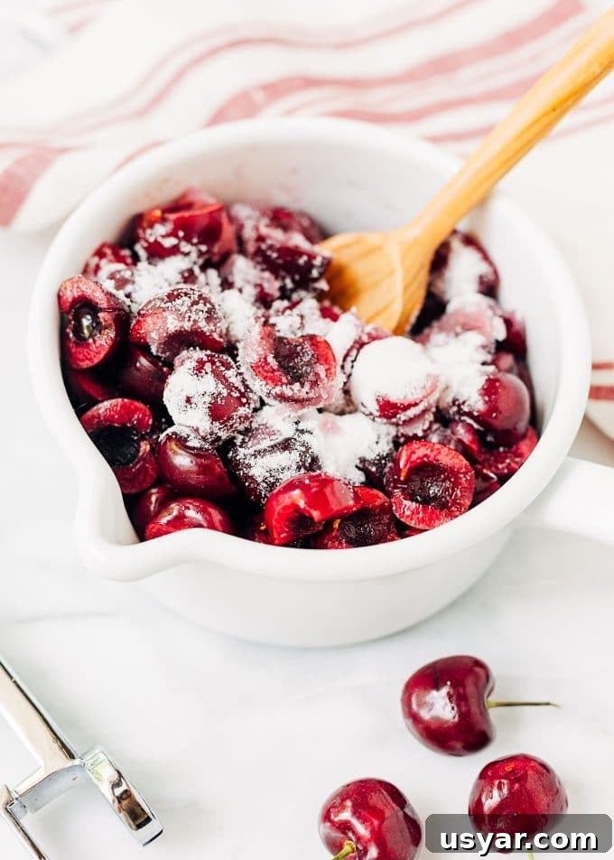 fresh bing cherries in a pot with sugar for ice cream