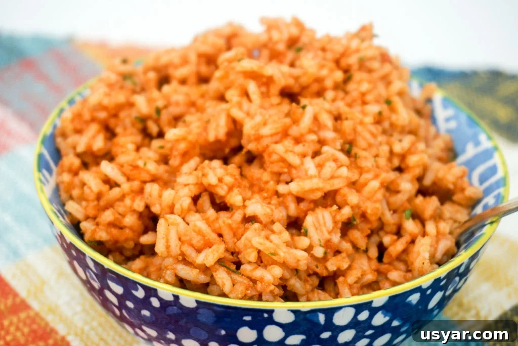 10-Minute Mexican Rice Recipe Made with Minute Rice 6 Step 2: Add tomato sauce and water then bring to a boil