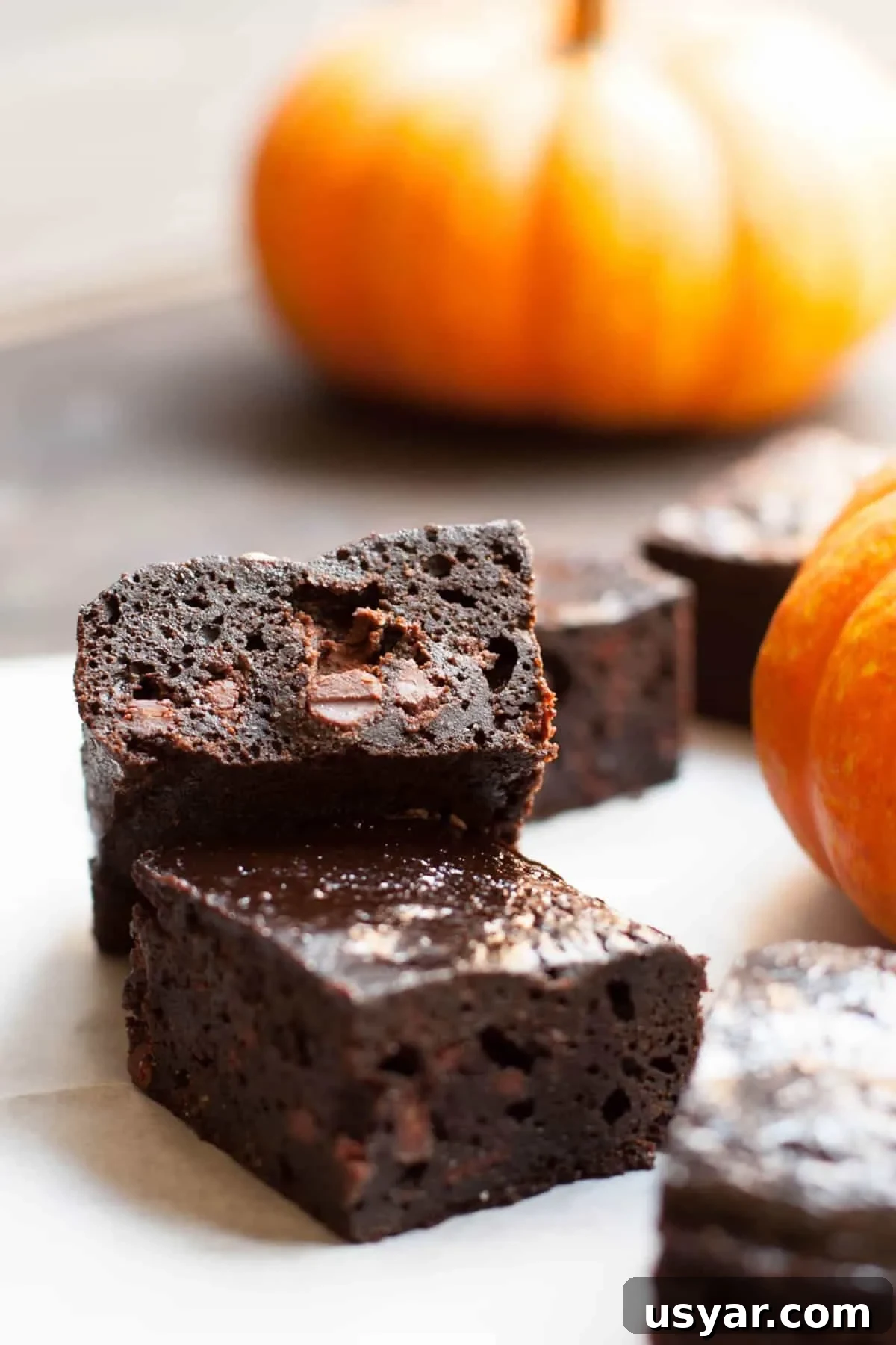One Bowl Fudgy Pumpkin Brownies uses pumpkin puree and a hit of pumpkin spice. The texture is reminiscent of flourless chocolate cake mashed up with a pumpkin pie. So good!