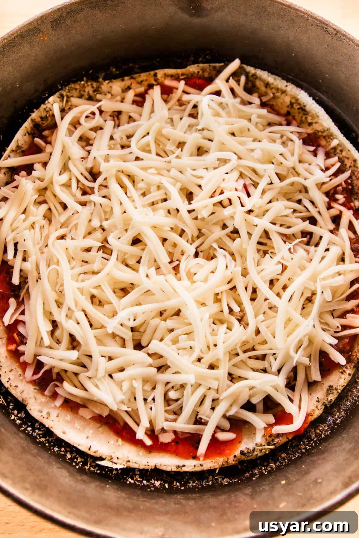 Sourdough Sausage Pizza Recipe with Crispy Golden Crust 7 Sourdough pizza crust with sauce and cheese.