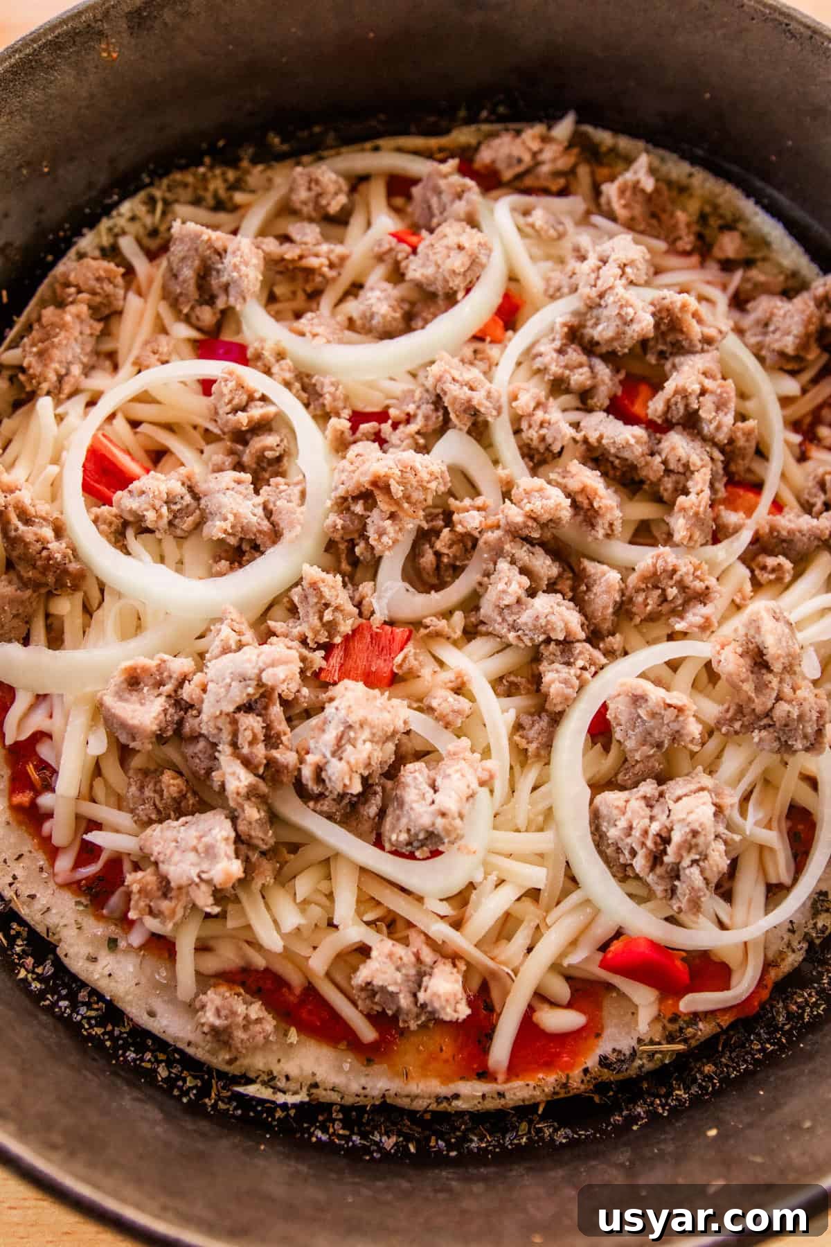 Sourdough Sausage Pizza Recipe with Crispy Golden Crust 9 Sausage and onions on a sourdough pizza.