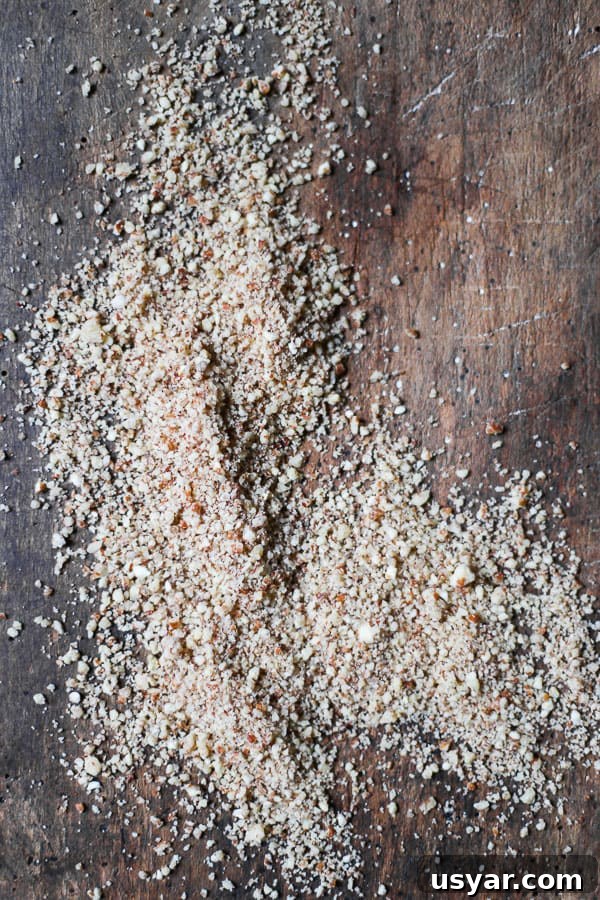 Nut Flours: Uses, Baking Tips and Substitutes 15 overhead shot of Pecan Meal on a wooden board