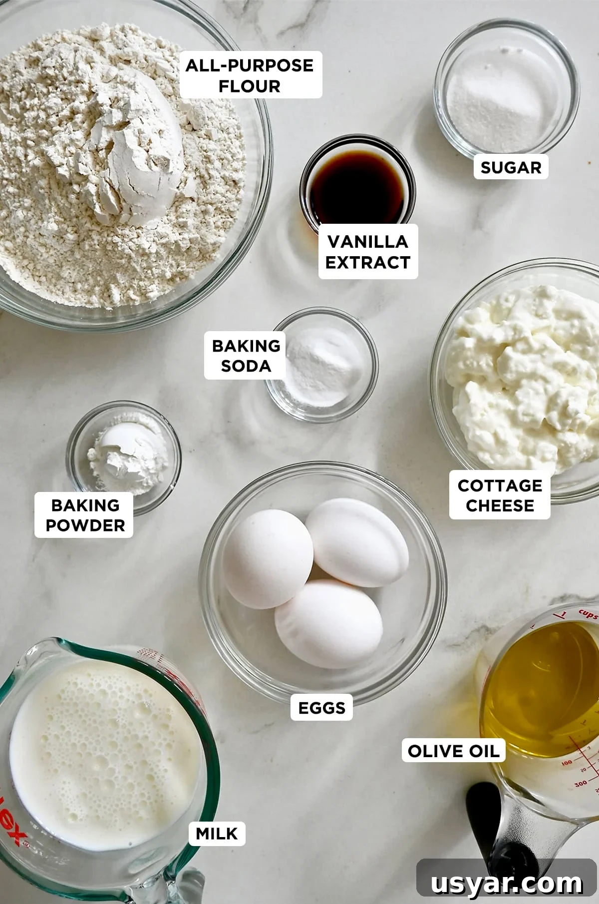 High-Protein Waffles: Fluffy, Filling Breakfast Recipe 4 Various sizes of glass bowls containing the ingredients to make protein waffles with cottage cheese.