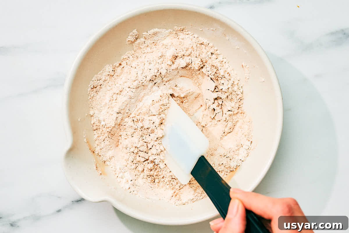 High-Protein Cottage Cheese Pancakes Recipe 7 Mixing together dry ingredients for cottage cheese pancakes recipe.