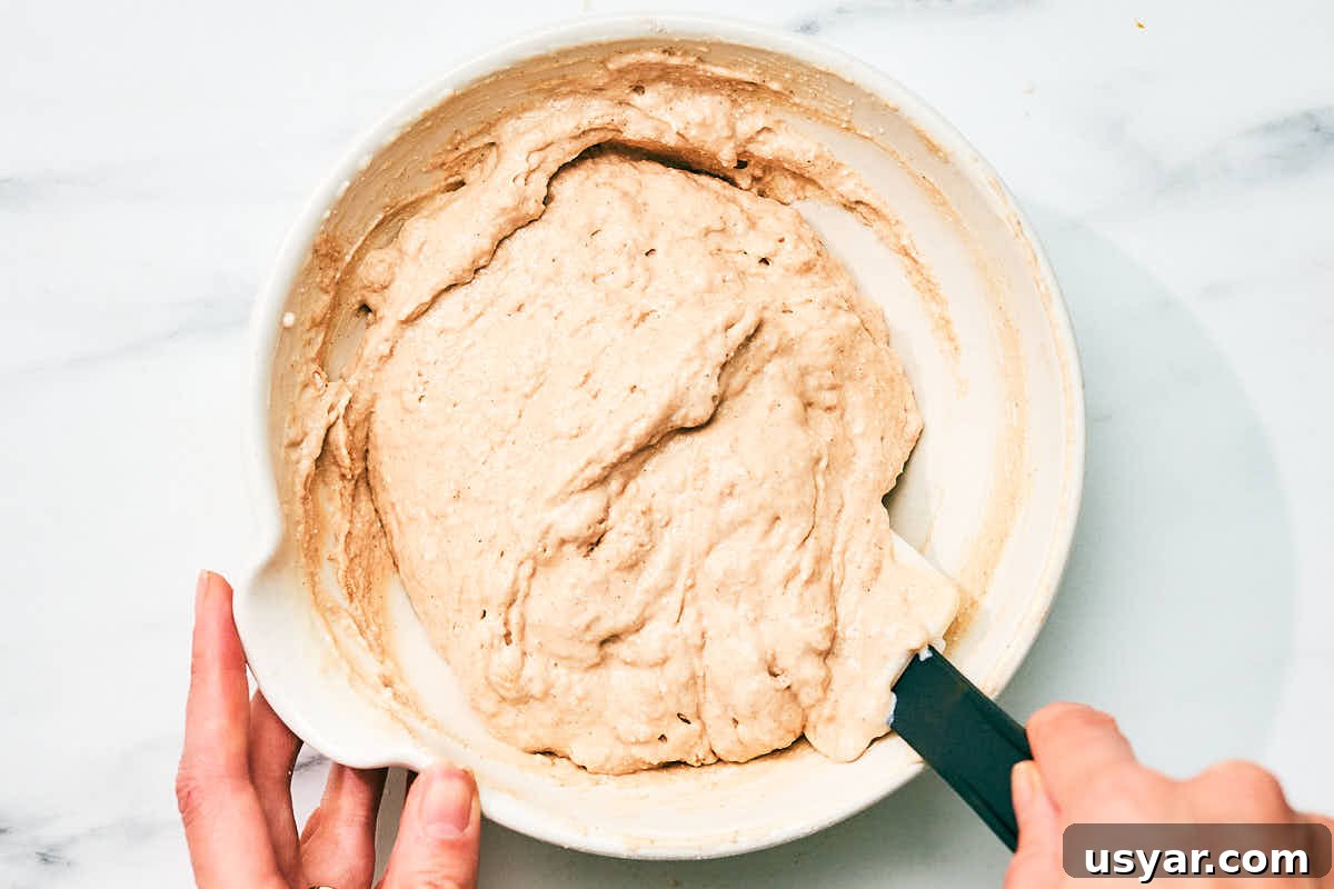 High-Protein Cottage Cheese Pancakes Recipe 9 High protein cottage cheese pancake batter being mixed in a bowl.