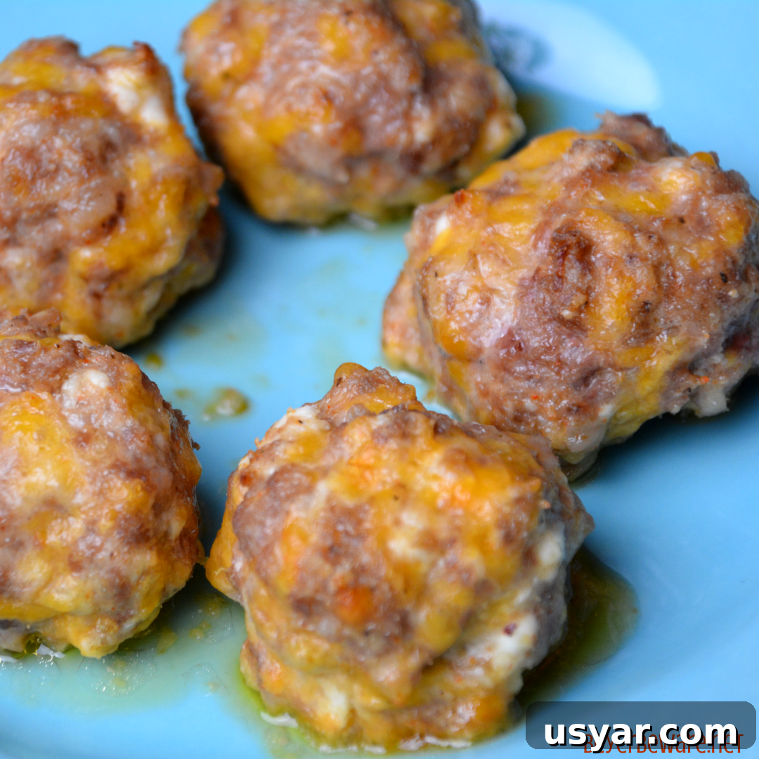 Low-Carb sausage balls use ground pork, cream cheese, parmesan and shredded cheeses to form the base for an oven baked pork meatball.