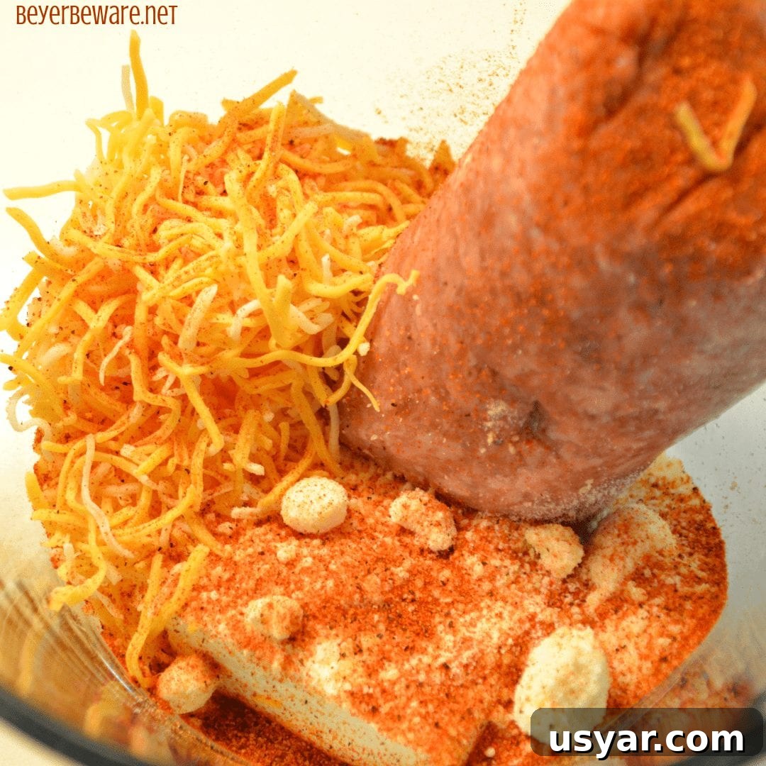 Mixing ingredients for low-carb sausage balls in a bowl.