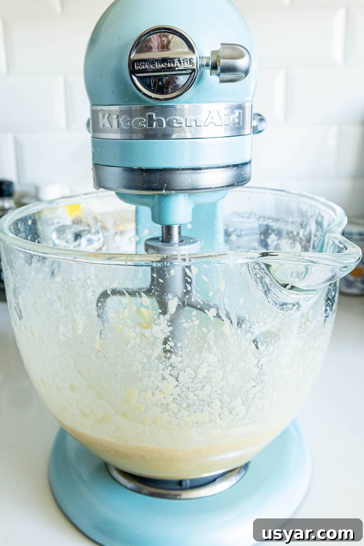 Homemade Baked Cinnamon Sugar Donut Holes Recipe 6 picture of batter being mixed in a stand mixer